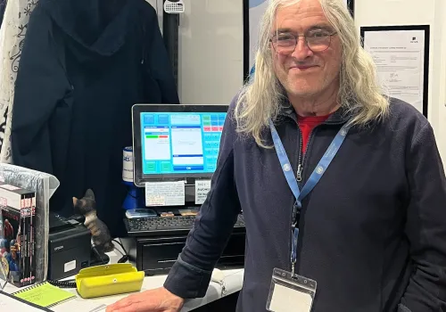 Volunteer Len at the Charity Shop on George Street, Bath 