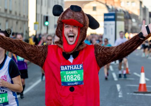 Man in dog costume during Bath Half marathon c Anna Barclay