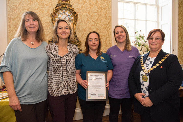 Together Project team receiving their Volunteer Team of the Year award 